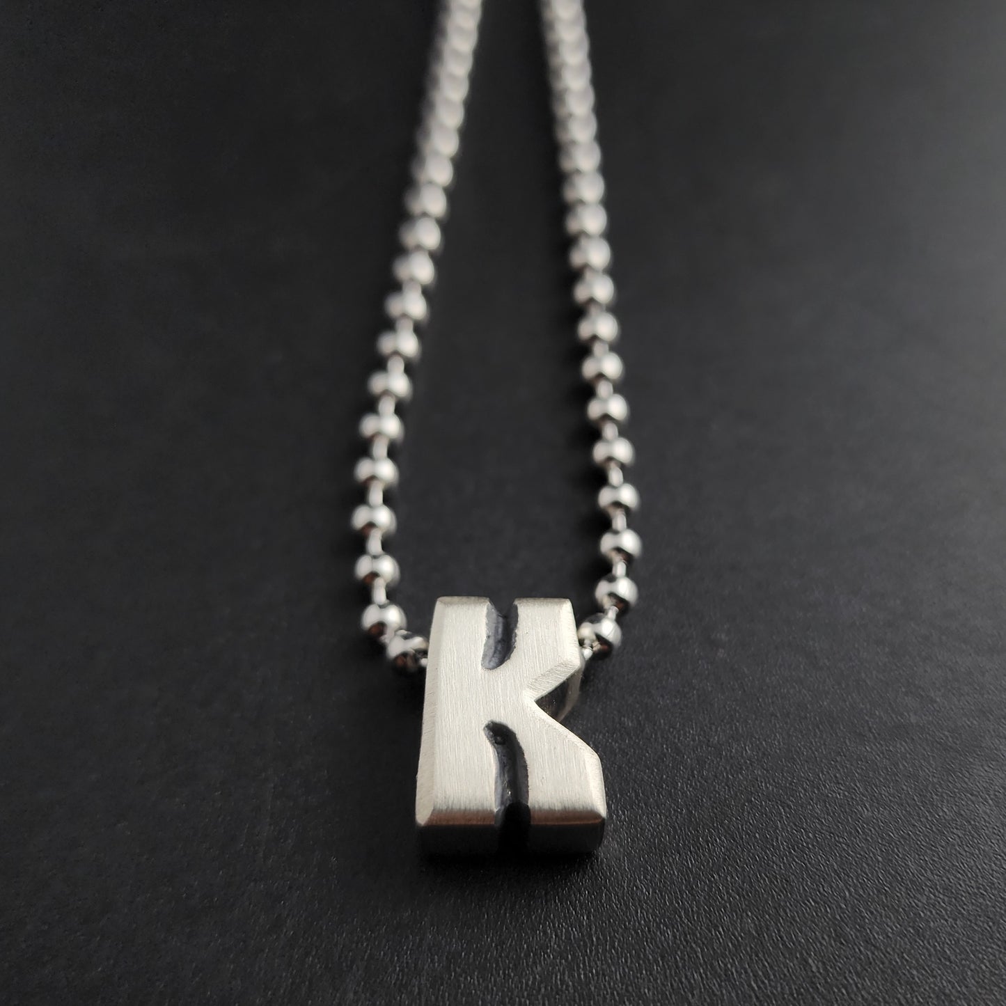 K (silver)