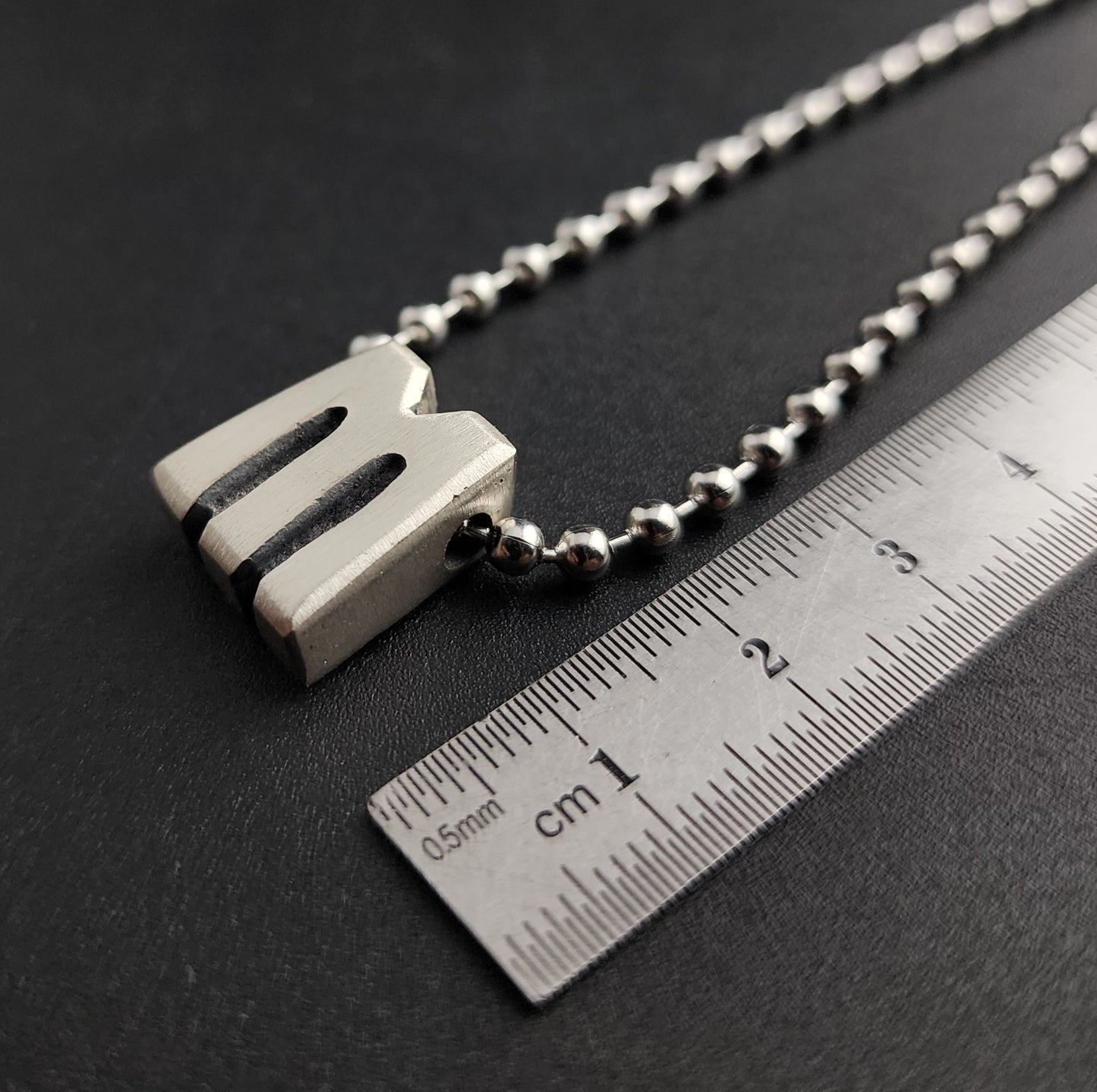 M (silver)