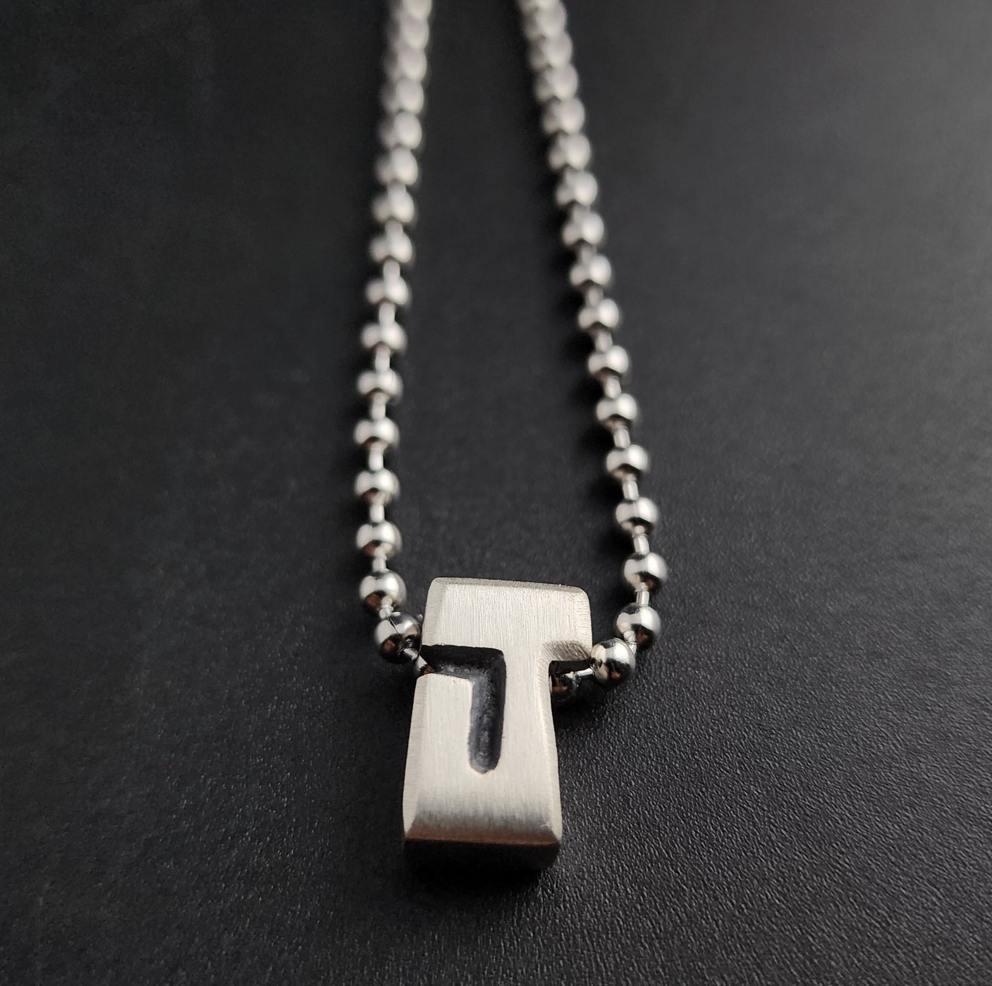 J (silver)