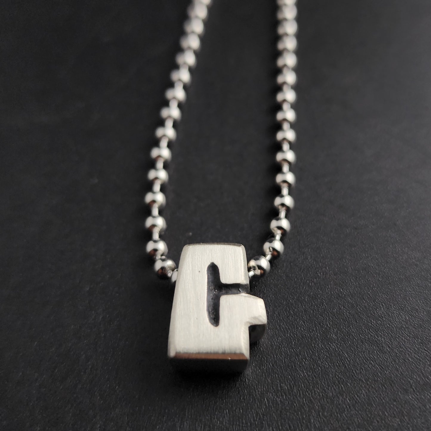 G (silver)