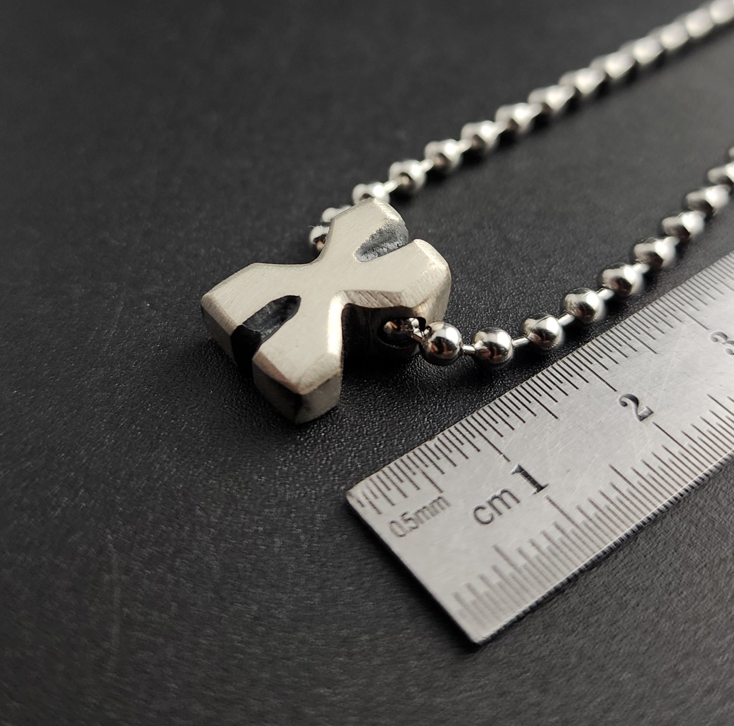 X (silver)