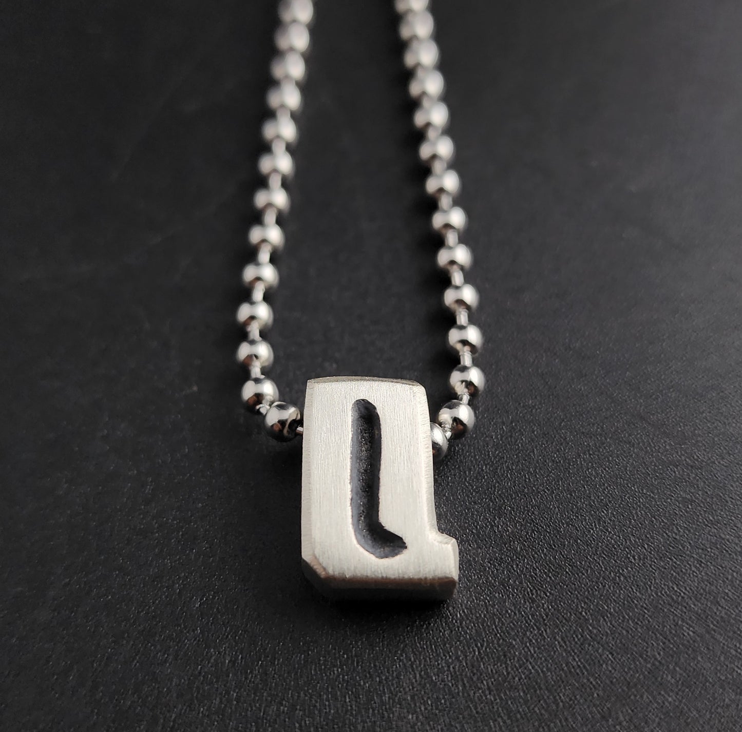 Q (silver)
