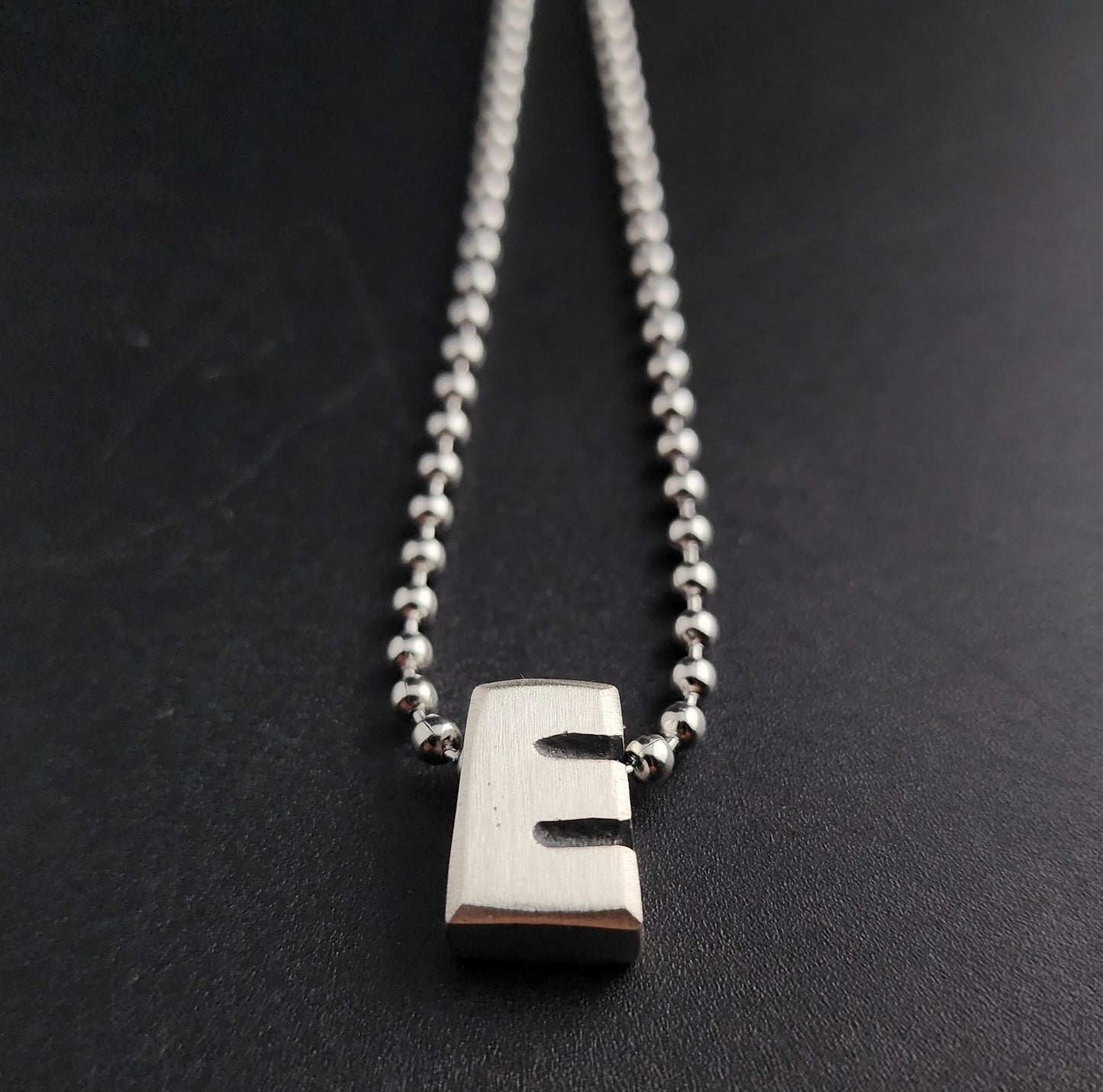 E (silver)