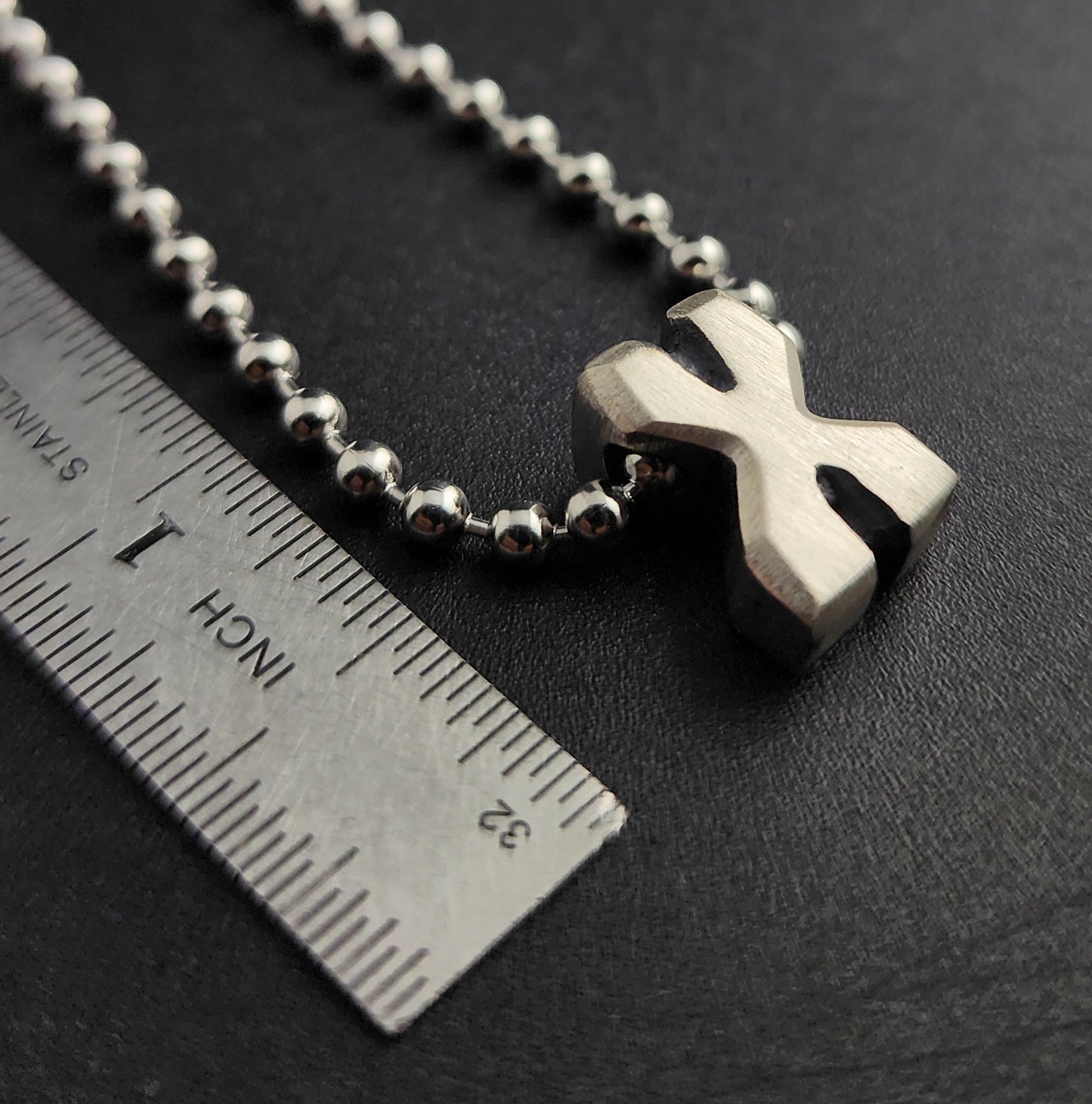 X (silver)