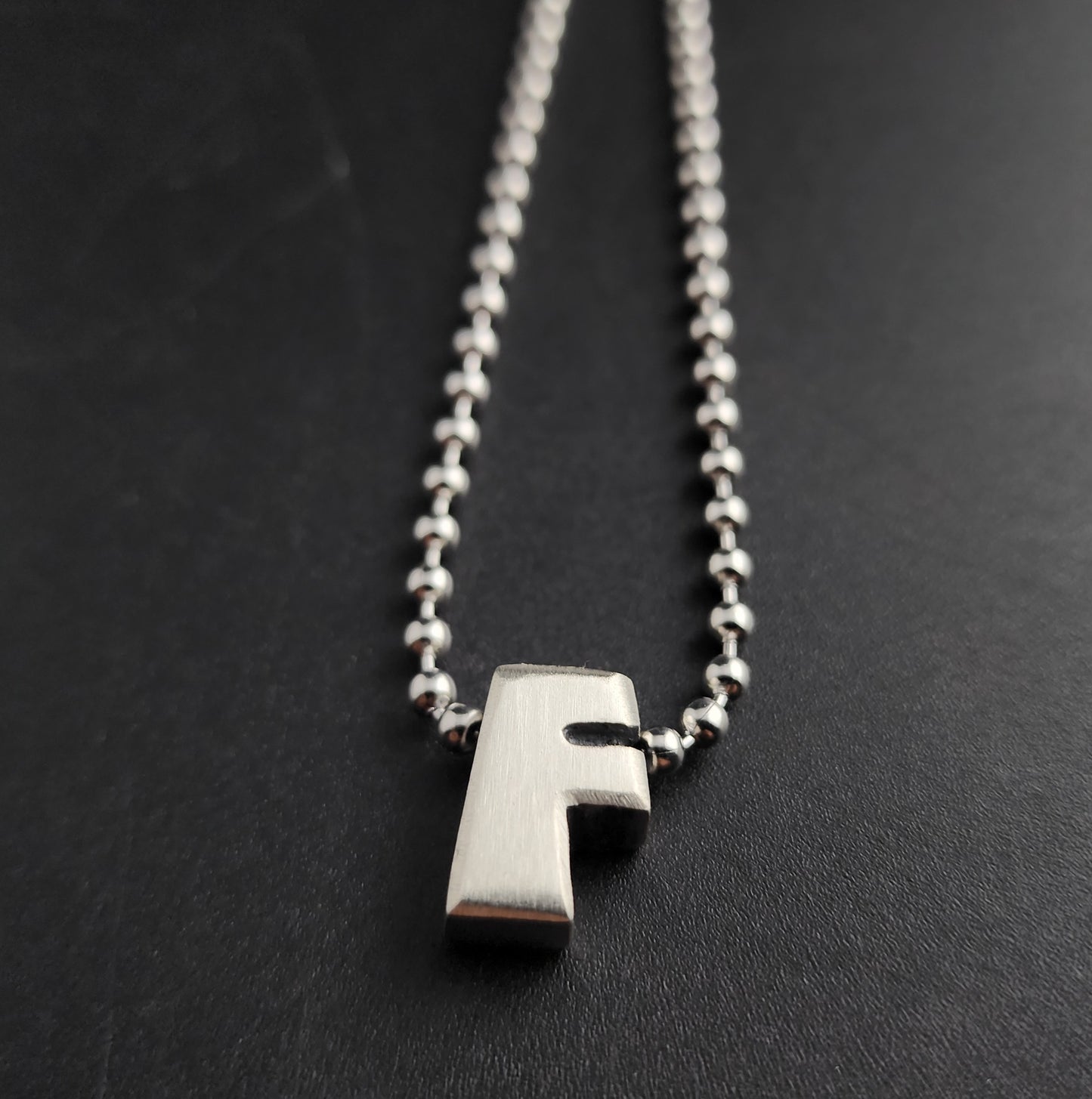 F (silver)